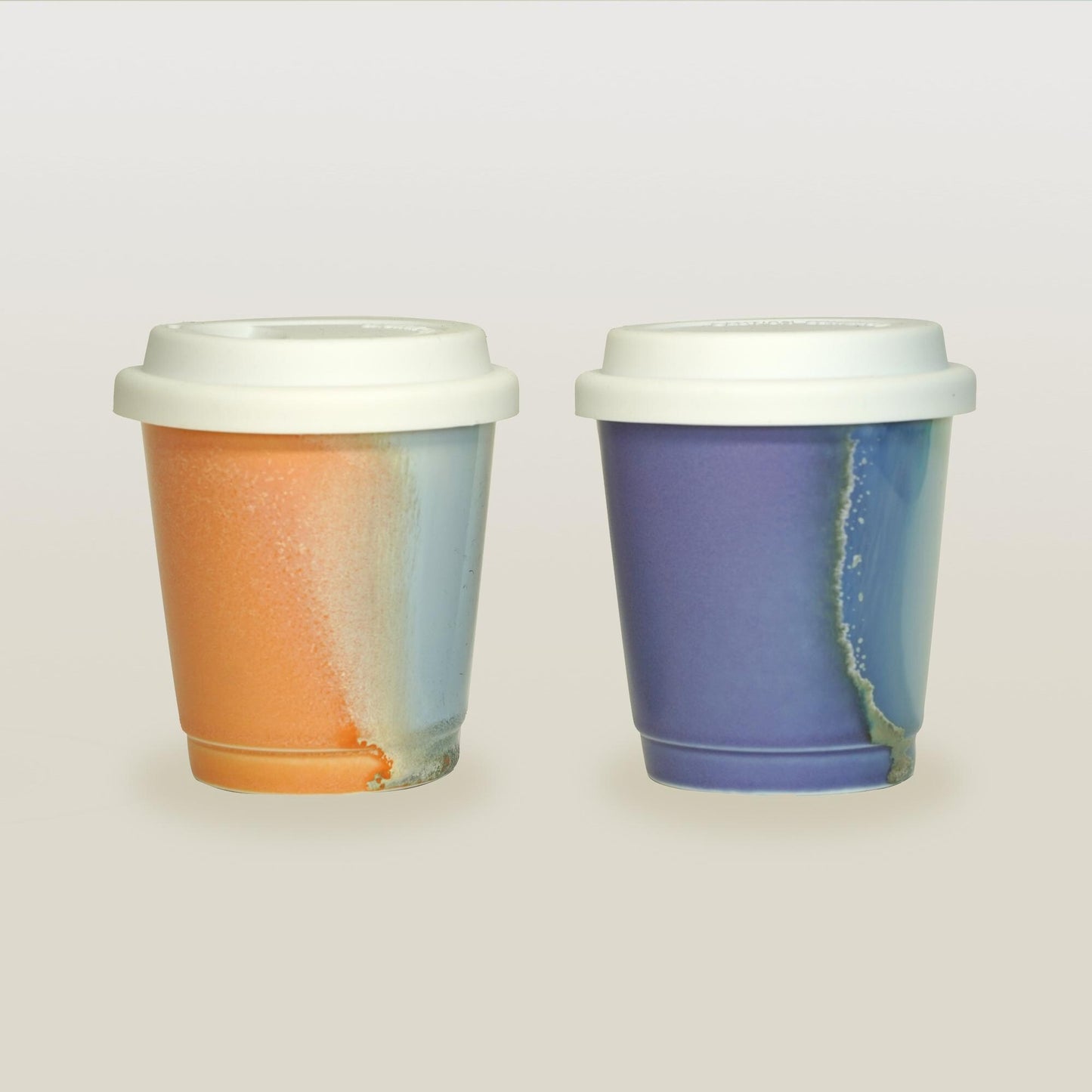 purple orange comparison  reusable to-go mug with white lid -  smoothies. Ergonomic grip, eco-friendly stoneware.