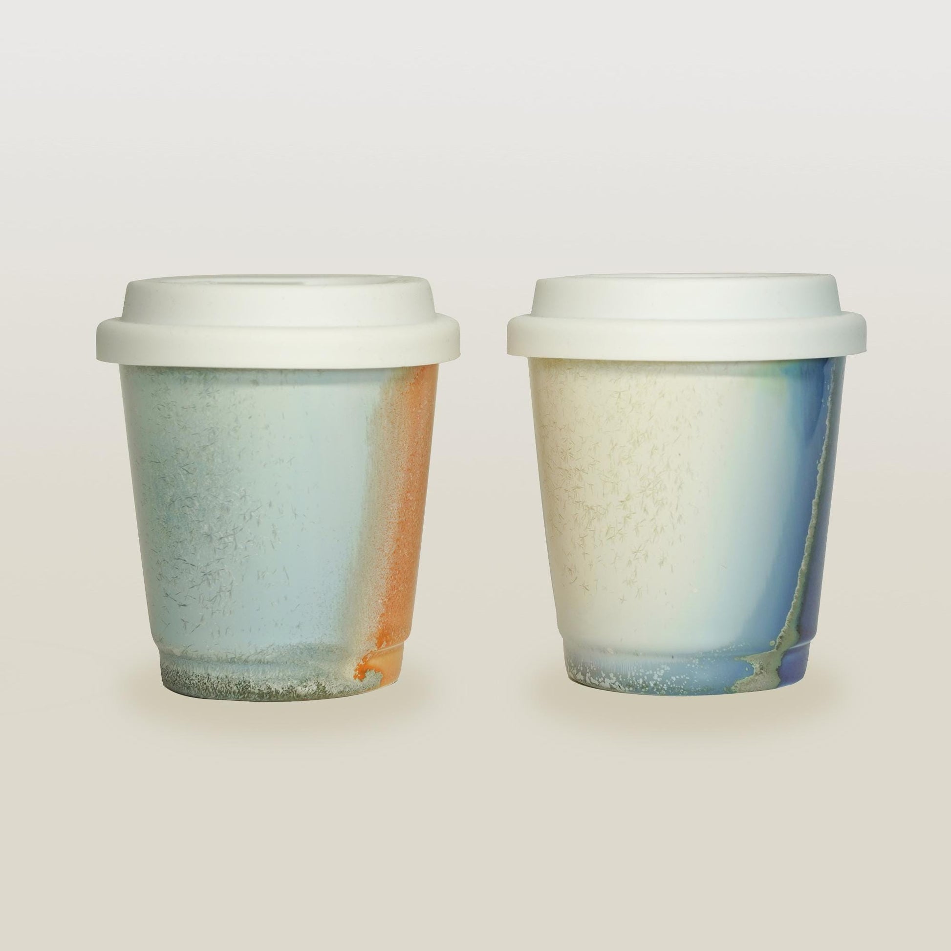 purple orange comparison  reusable to-go mug with white lid -  smoothies. Ergonomic grip, eco-friendly
