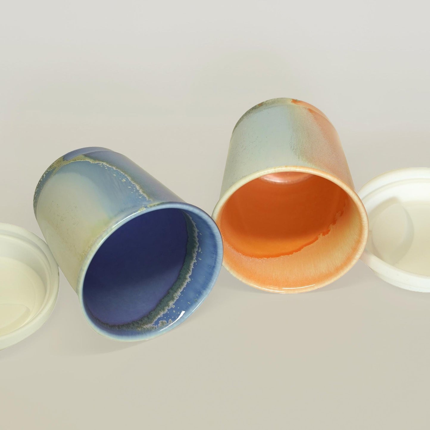 inside of purple orange comparison  reusable to-go mug with white lid -  smoothies. Ergonomic grip, eco-friendly stoneware.